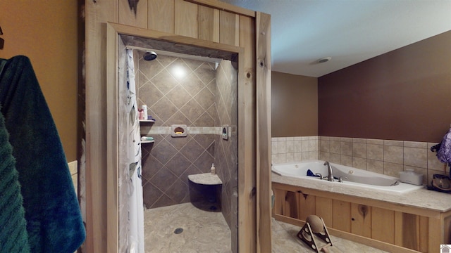 bathroom featuring shower with separate bathtub and tile patterned flooring