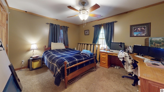 carpeted bedroom featuring ornamental molding and ceiling fan