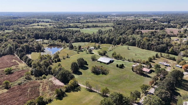 birds eye view of property featuring a water view and a rural view