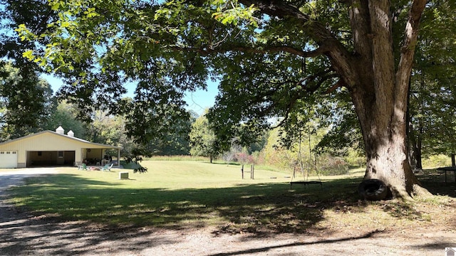 view of yard with a garage