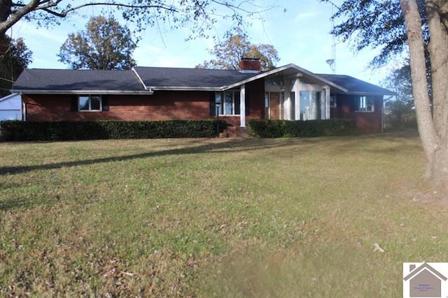 ranch-style home with a front yard