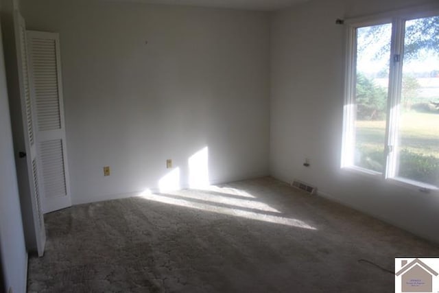 empty room featuring carpet flooring