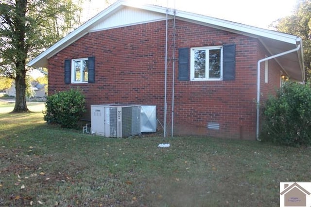 view of property exterior featuring cooling unit and a yard