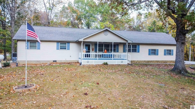 ranch-style house with covered porch and a front lawn