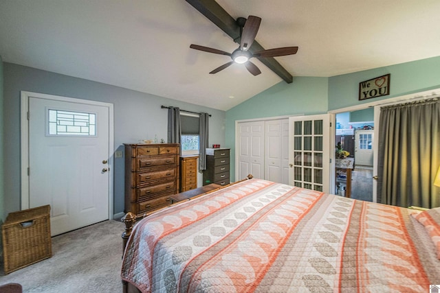 carpeted bedroom featuring a closet, lofted ceiling with beams, and ceiling fan