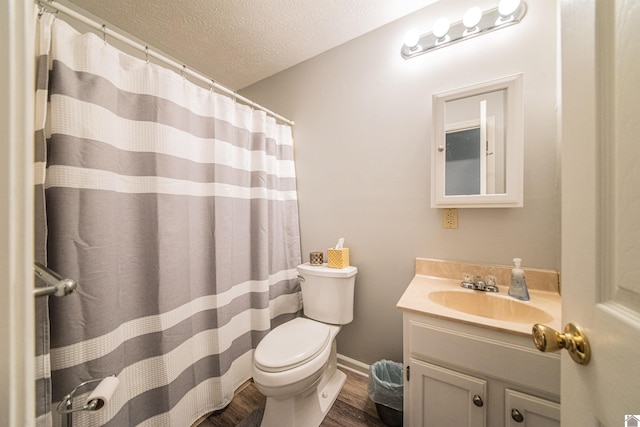 bathroom featuring toilet, a textured ceiling, vanity, and hardwood / wood-style floors