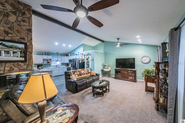 living room with sink, vaulted ceiling with beams, light colored carpet, and ceiling fan