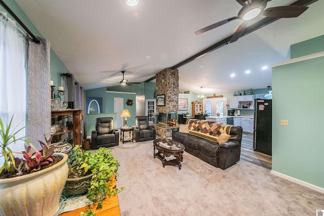 carpeted living room with lofted ceiling with beams, a fireplace, and ceiling fan