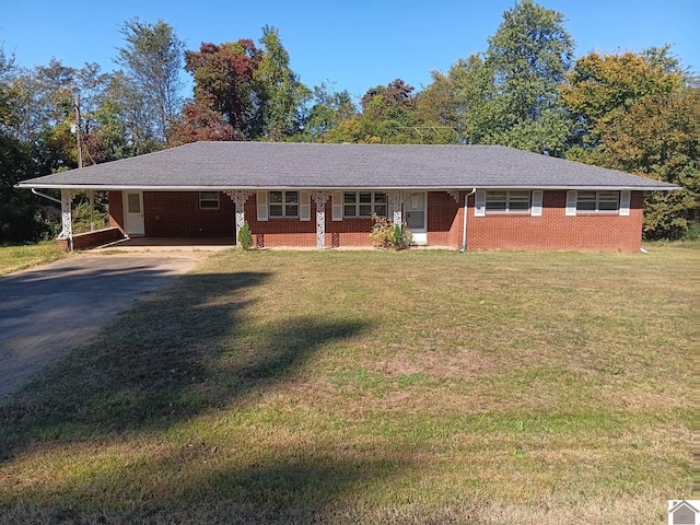 23 Piper, Clinton, KY 42031 - ranch-style home featuring driveway, an attached carport, a front lawn, and brick siding