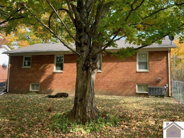 view of property exterior featuring central AC