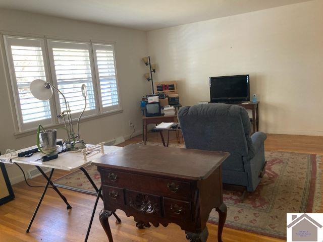 office space with light wood-type flooring