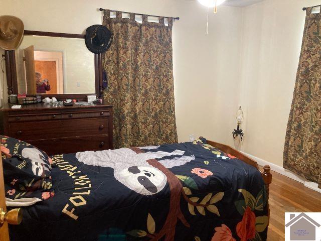 bedroom featuring wood-type flooring