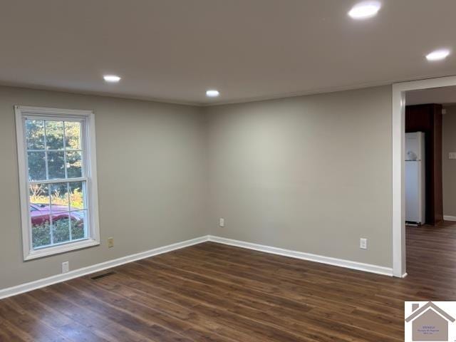 empty room with dark wood-type flooring