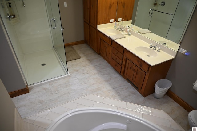 full bathroom with vanity, toilet, and separate shower and tub