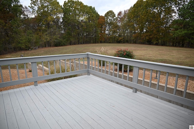 wooden terrace with a lawn