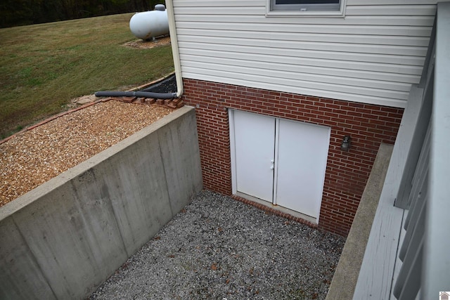 view of storm shelter with a yard