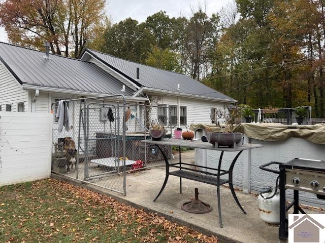 rear view of property featuring a patio