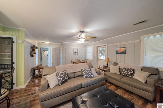 living room featuring ornamental molding, dark hardwood / wood-style floors, and ceiling fan