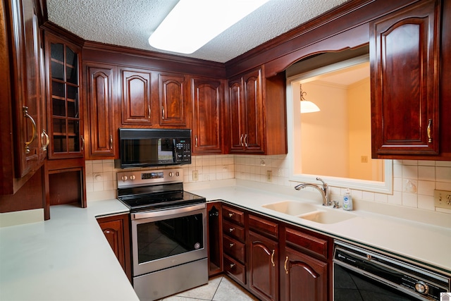 kitchen featuring a textured ceiling, sink, black appliances, and tasteful backsplash