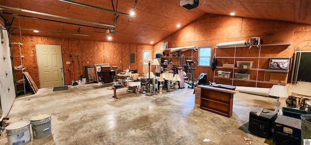 miscellaneous room with concrete flooring and lofted ceiling