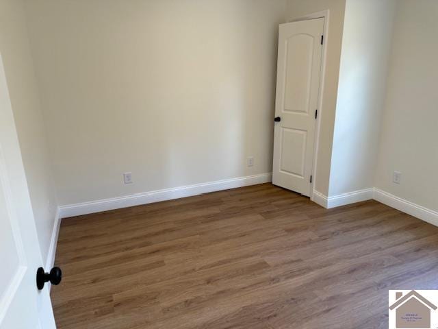 empty room featuring wood-type flooring