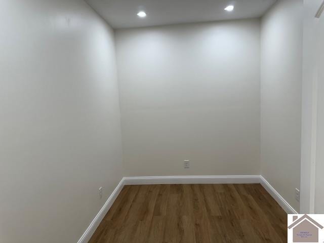 spare room with dark hardwood / wood-style flooring