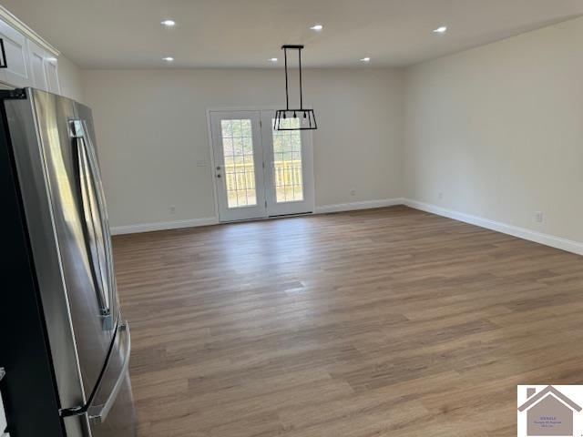 unfurnished dining area with light hardwood / wood-style floors