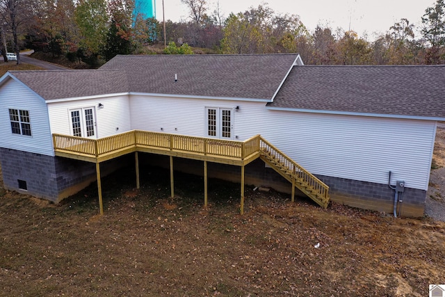 back of house with french doors and a deck