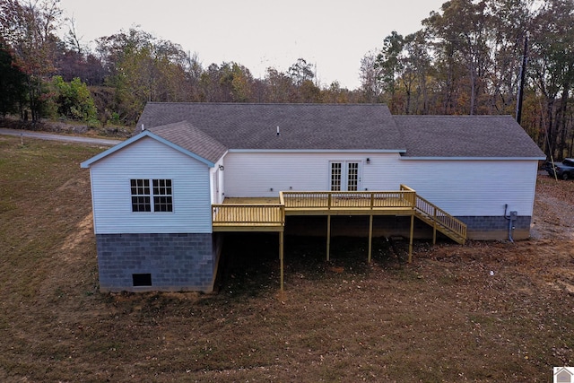 back of house featuring a wooden deck