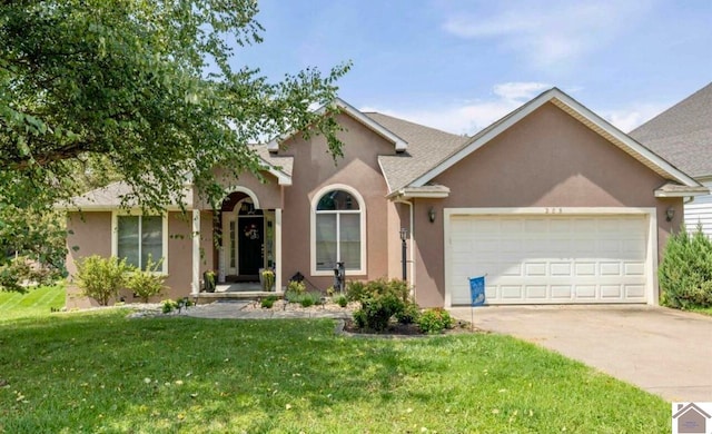 ranch-style home featuring a front lawn and a garage