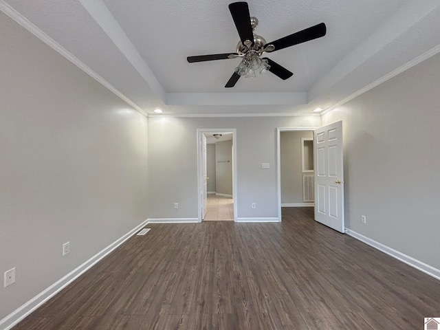 interior space featuring dark wood-type flooring, ceiling fan, and crown molding