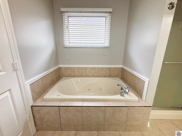 bathroom featuring tile patterned floors and shower with separate bathtub