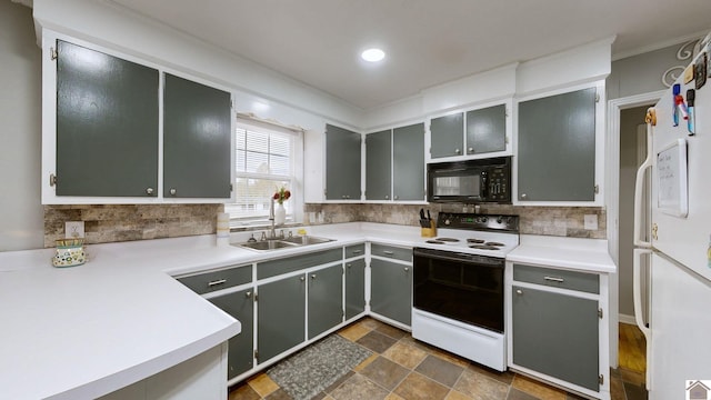 kitchen with gray cabinetry, sink, white appliances, and backsplash