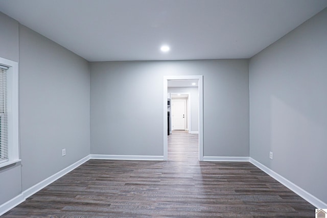 empty room featuring dark wood-type flooring