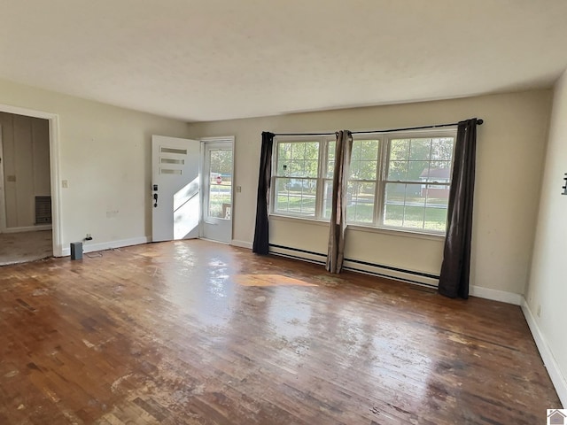 interior space featuring a baseboard radiator and dark hardwood / wood-style flooring