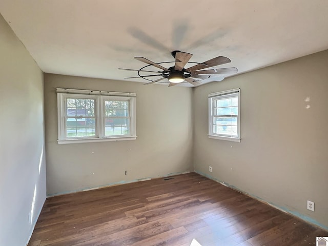 spare room featuring hardwood / wood-style flooring and ceiling fan