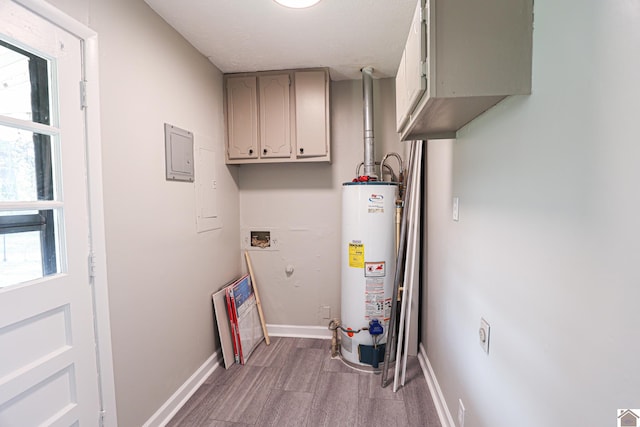 utility room featuring water heater