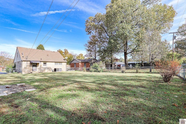 view of yard featuring cooling unit and fence