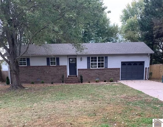 ranch-style home with a garage and a front lawn