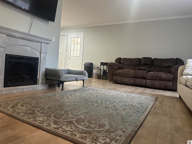 living room featuring ornamental molding and hardwood / wood-style flooring