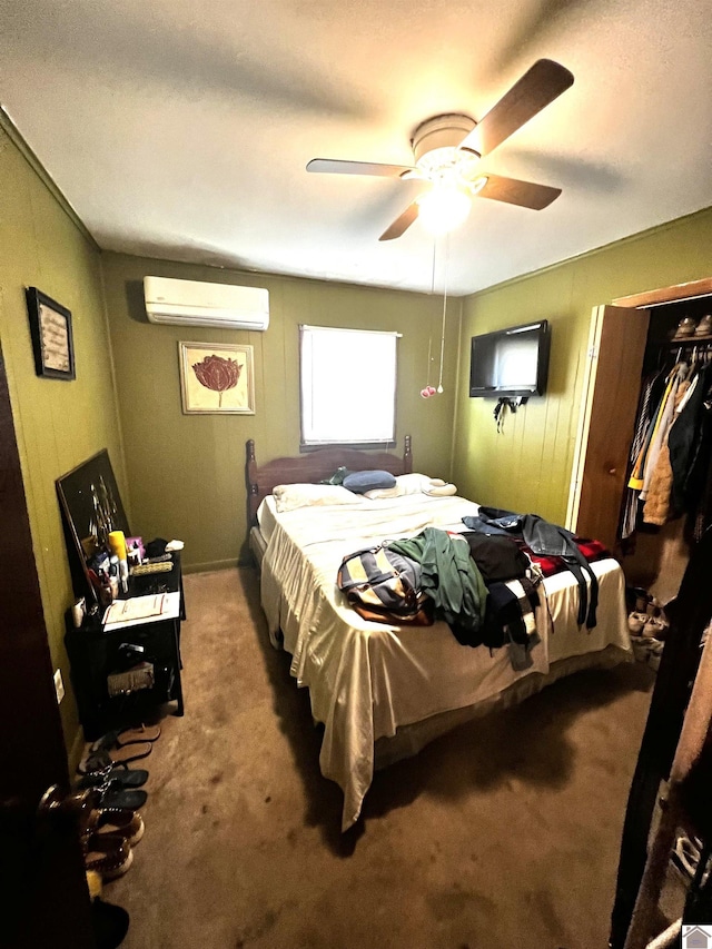 bedroom with ceiling fan, a closet, carpet floors, and a wall mounted AC