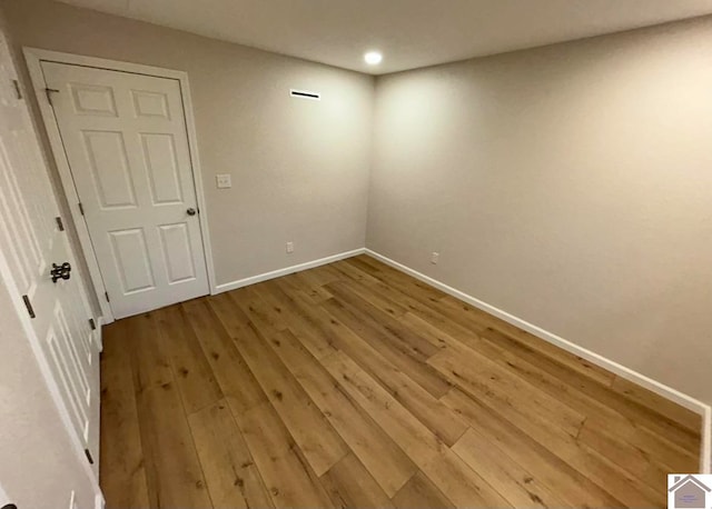 empty room featuring wood-type flooring