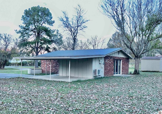 view of outbuilding featuring a yard and a carport