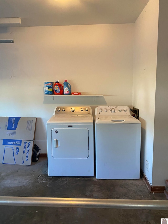 clothes washing area featuring washer and clothes dryer