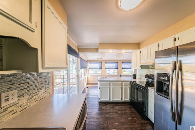 kitchen featuring white cabinets, decorative backsplash, stainless steel appliances, and dark wood-type flooring