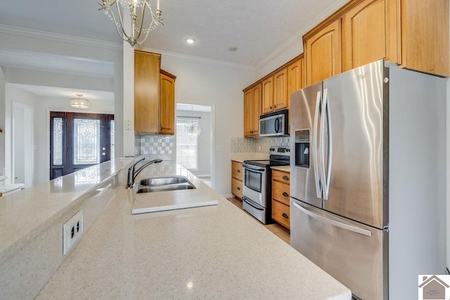 kitchen with decorative backsplash, stainless steel appliances, sink, and crown molding