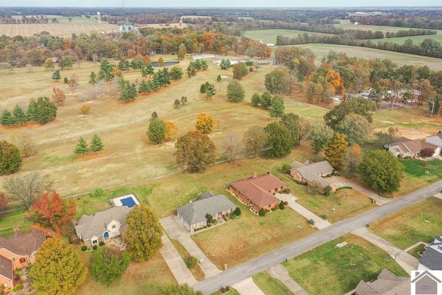 birds eye view of property with a rural view