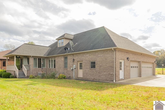 exterior space with a garage and a lawn