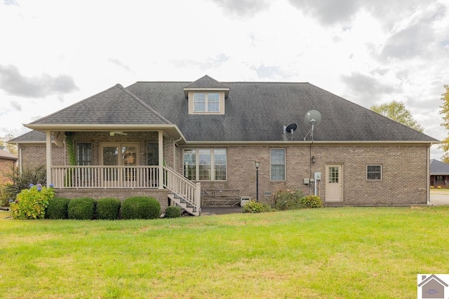 back of house featuring a porch and a lawn