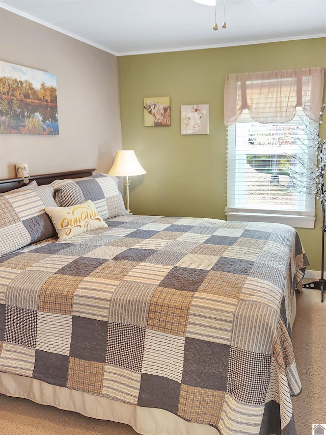 carpeted bedroom featuring ornamental molding